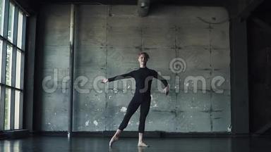 黑色背景下的男芭蕾舞演员的肖像。 舞蹈演员踮着脚旋转，动作很漂亮。 <strong>慢慢慢慢</strong>